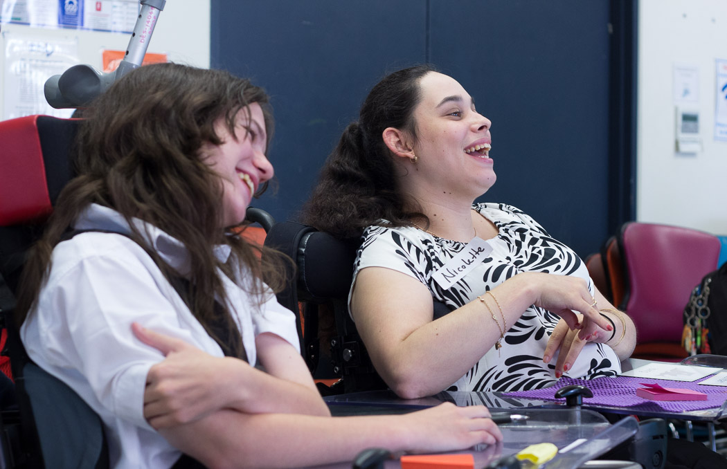 Two JFY members laughing