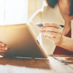 Photo of person using a tablet.