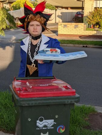 Leeanne dresses up as Yugi from the manga Yu-Gi-Oh! as part of bin isolation fun.
