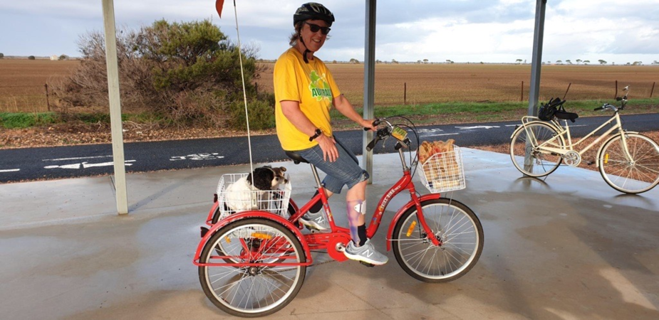 Jane on her bike on the bike trails in Kadina. Her two dogs are in the rear bike basket.